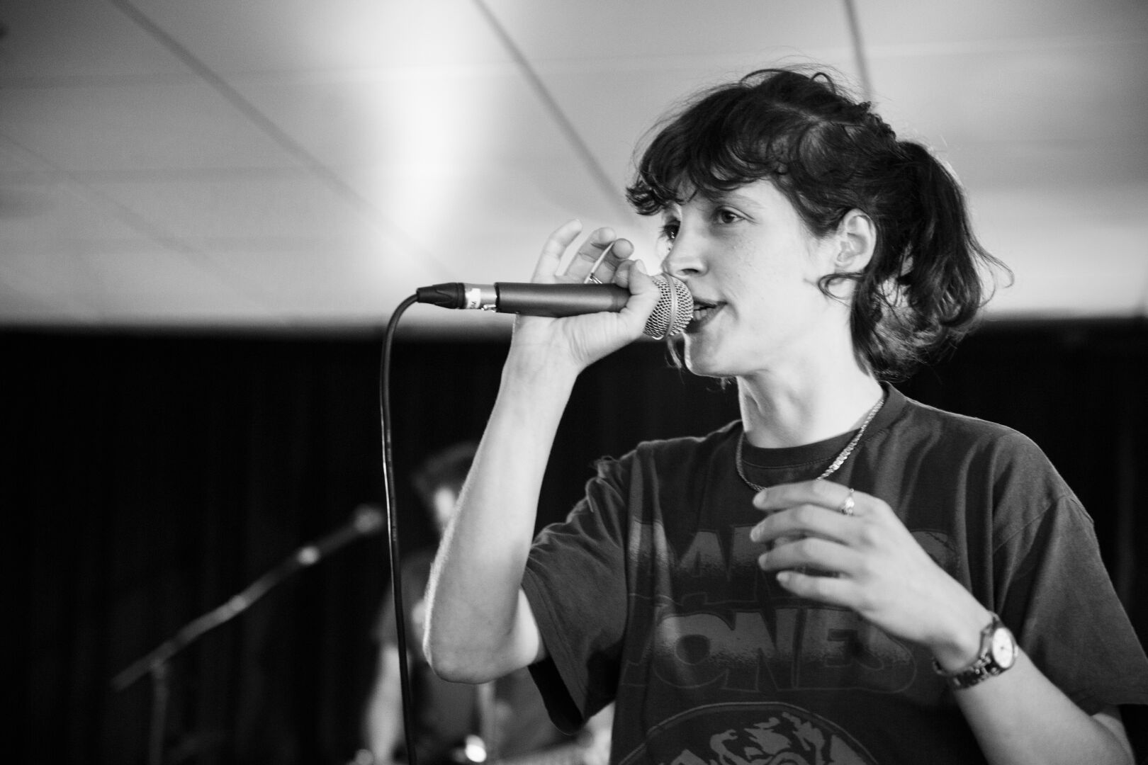 black and white portrait of the singer holding her micro close to her mouth