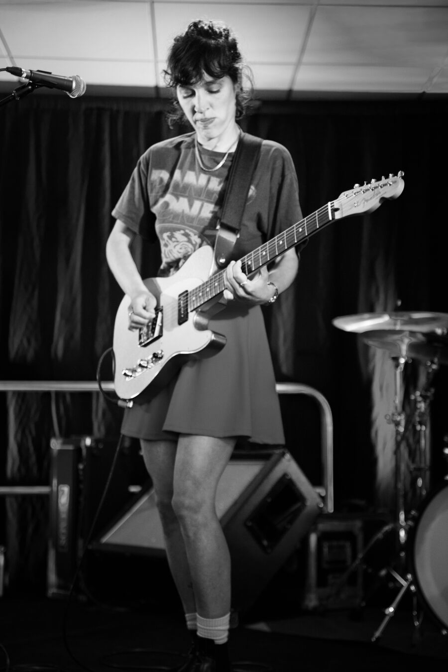 black and white photo of the singer playing guitar